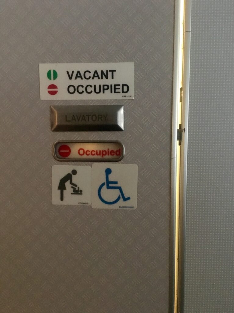 Occupied sign on airplane bathroom